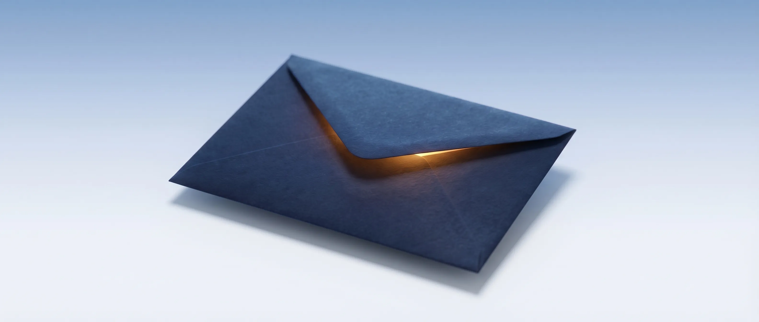 A dark envelope with warm light glowing from its sealed flap