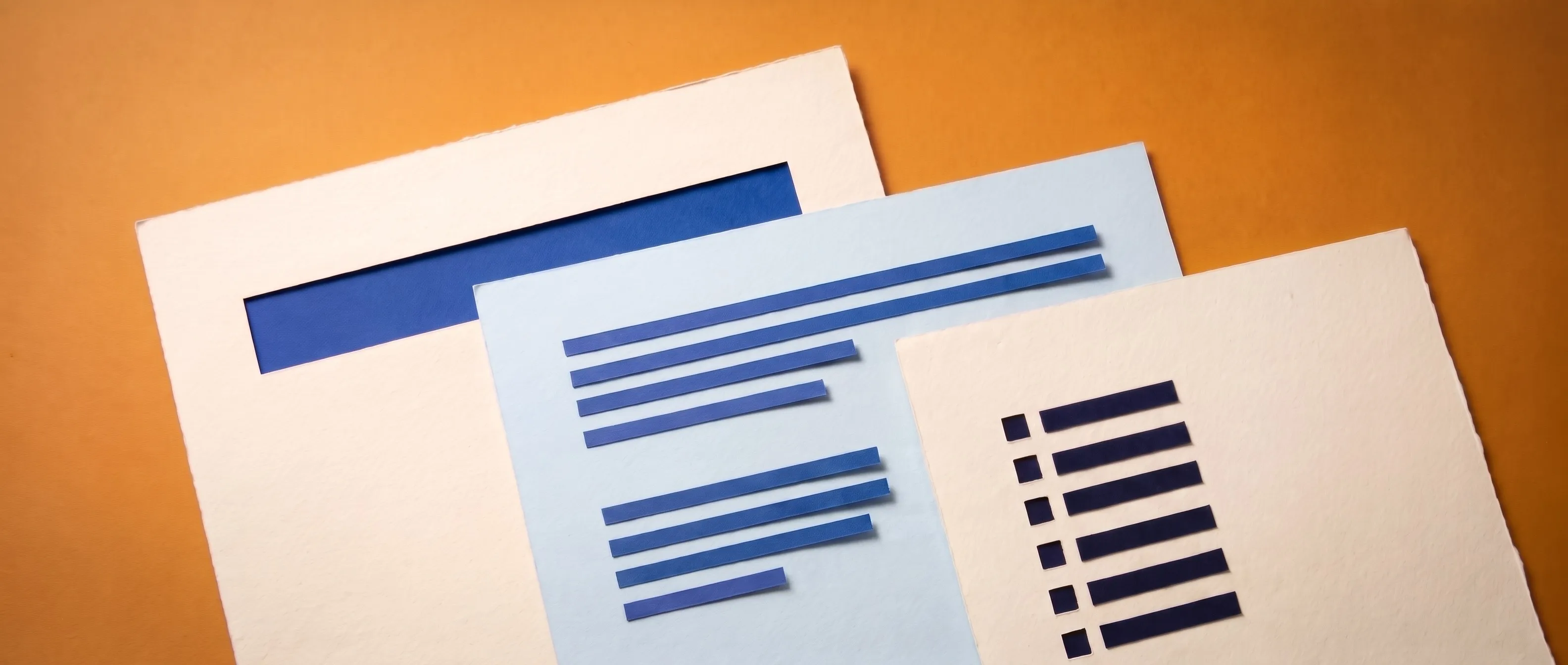 Three overlapping sheets of cut paper on an amber background. From left to right, a cream sheet with a single blue bar, a pale blue sheet with two short paragraphs of blue lines, and a cream sheet with a checklist.